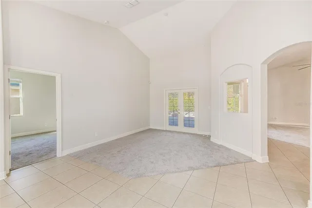 a view of an empty room and glass door