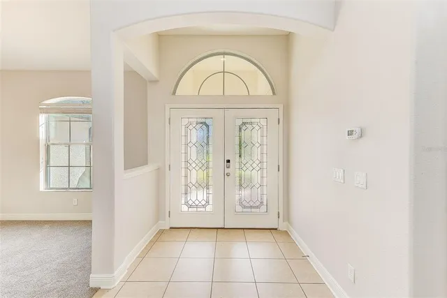 a kitchen with stainless steel appliances granite countertop a sink a refrigerator and a stove