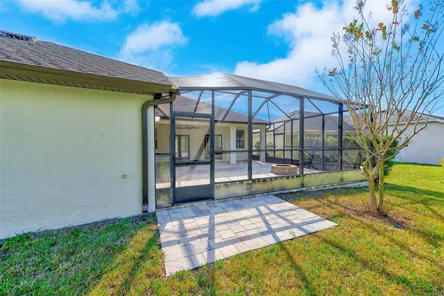 an aerial view of residential houses with outdoor space and swimming pool