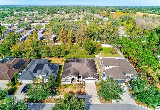 a view of a swimming pool with an outdoor space and seating area