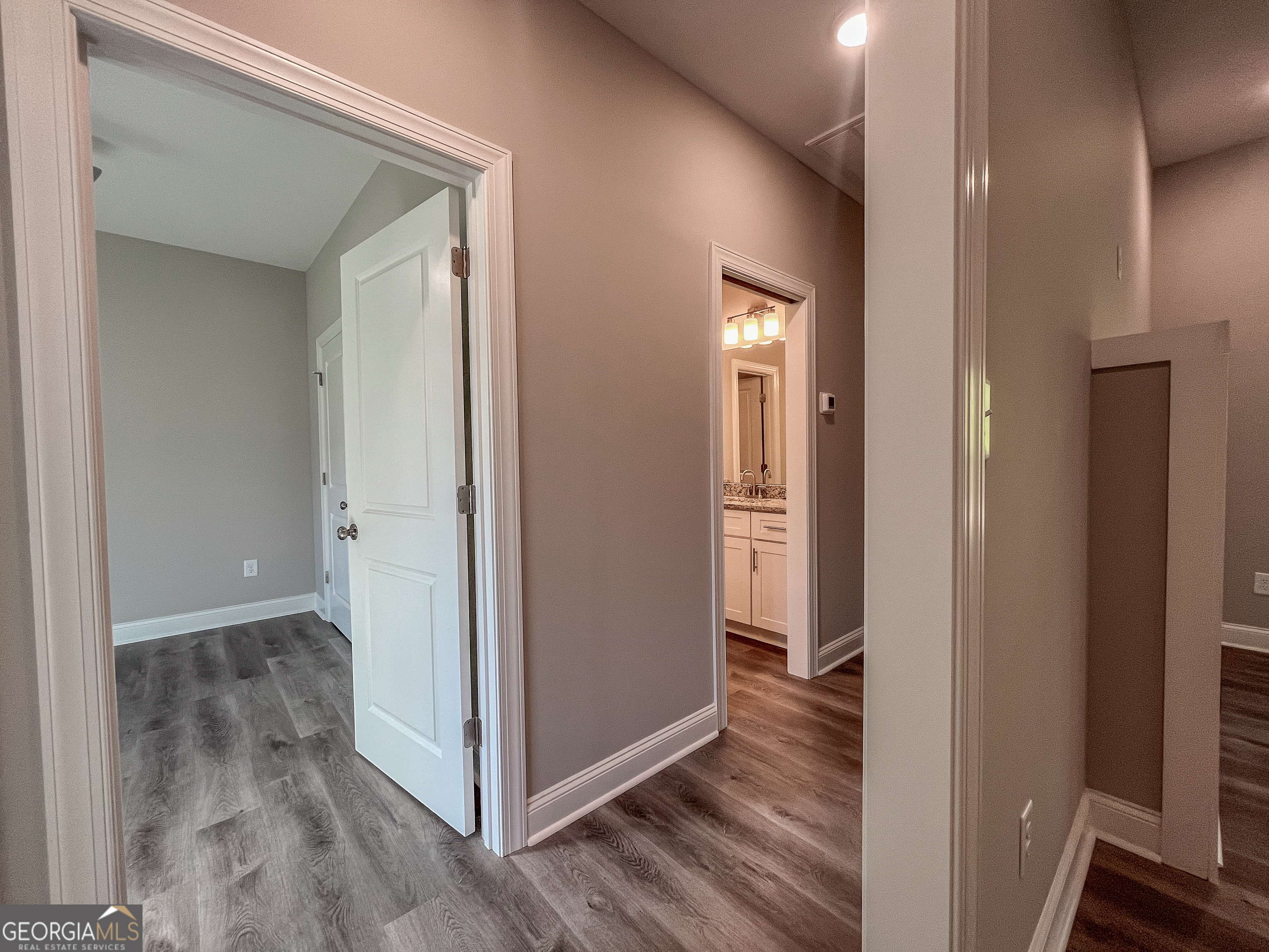 711 Flanders Lane Dublin, GA 31021 - Photo 29 of 49 a view of a hallway with wooden floor