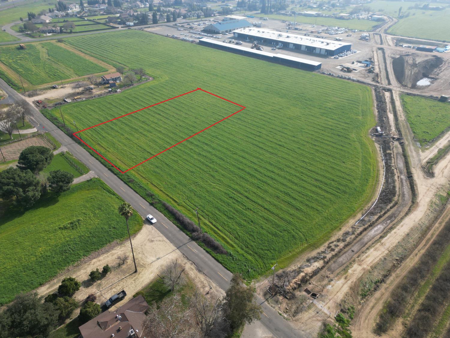 2 West Belcher Avenue Merced, CA 95348 - Photo 2 of 6 a green field with lots of trees in the background