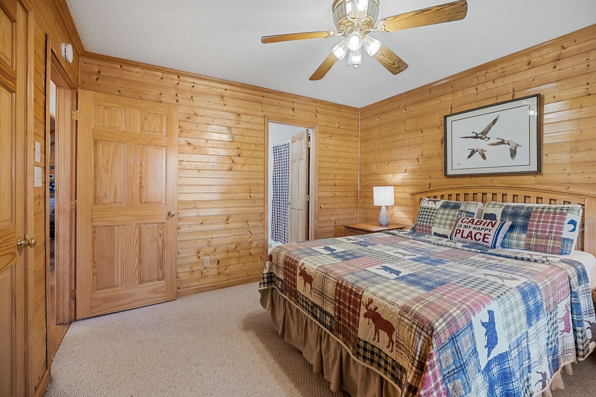 5606 Eastport Road Alpine, TN 38543 - Photo 31 of 44 a bedroom with a bed and a chandelier