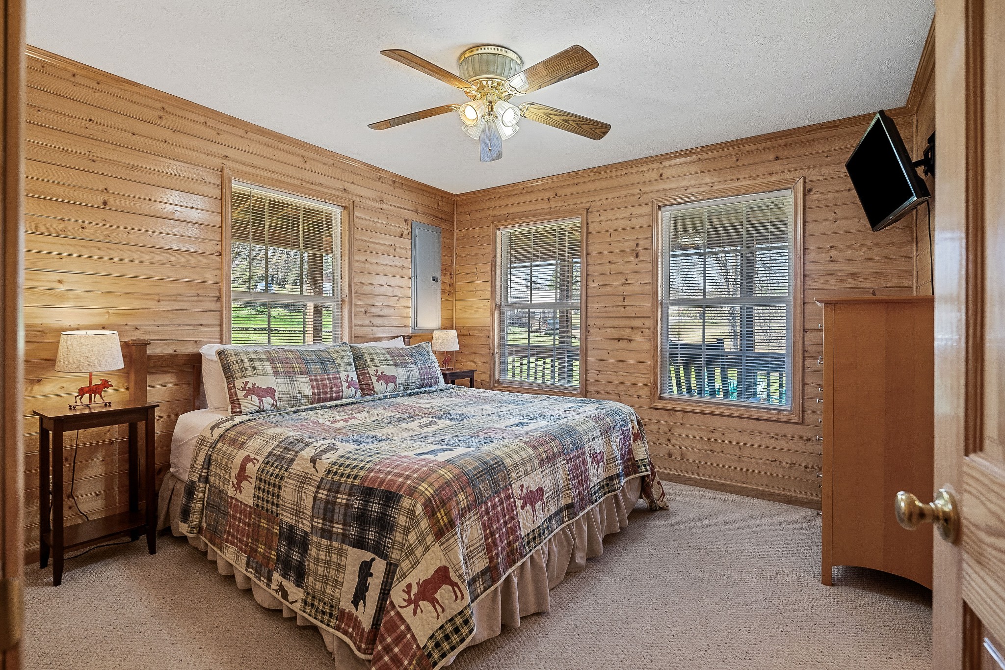 5606 Eastport Road Alpine, TN 38543 - Photo 32 of 44 a bedroom with a bed a window and a chandelier