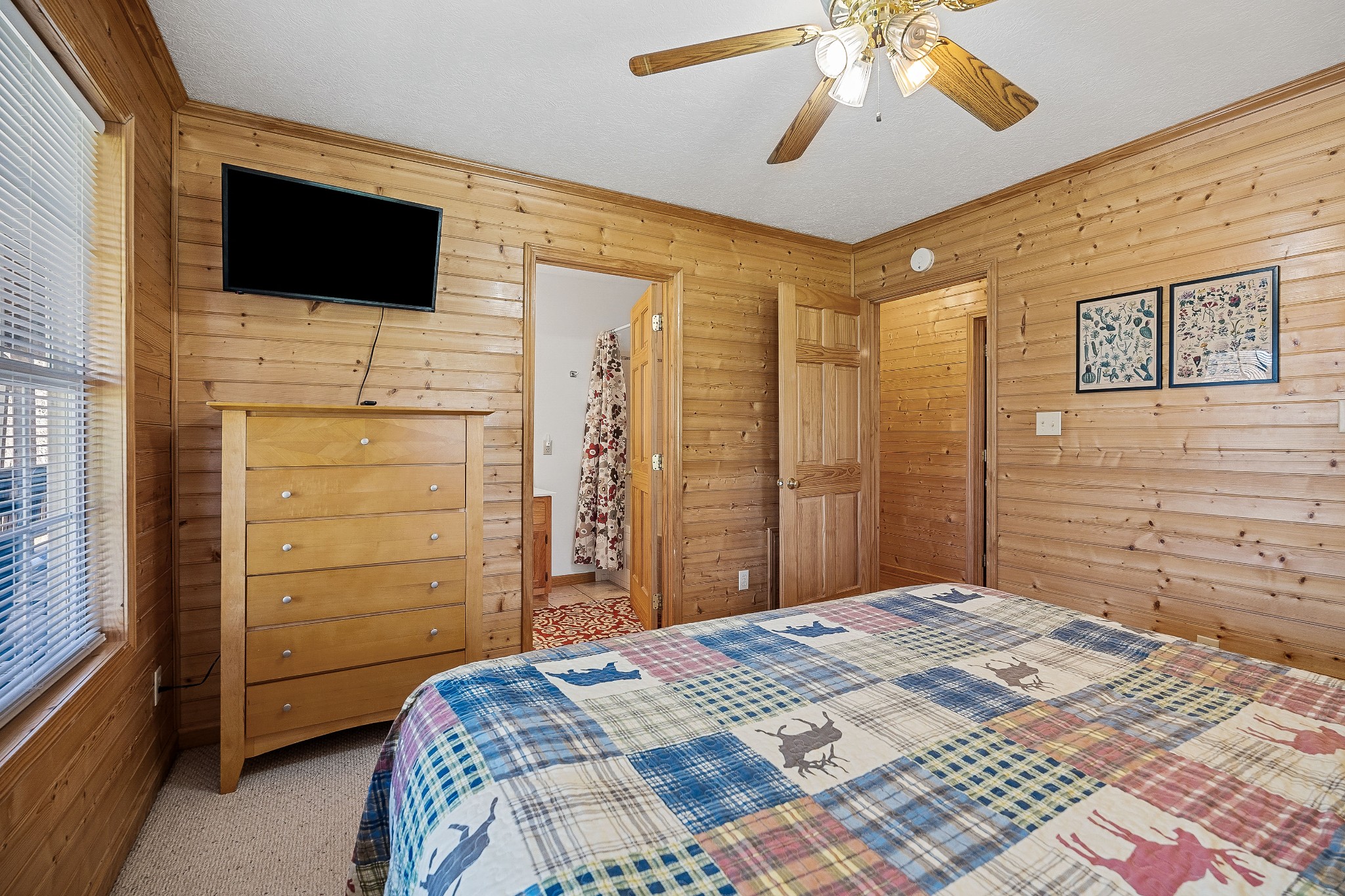 5606 Eastport Road Alpine, TN 38543 - Photo 33 of 44 a bedroom with a bed and a flat screen tv