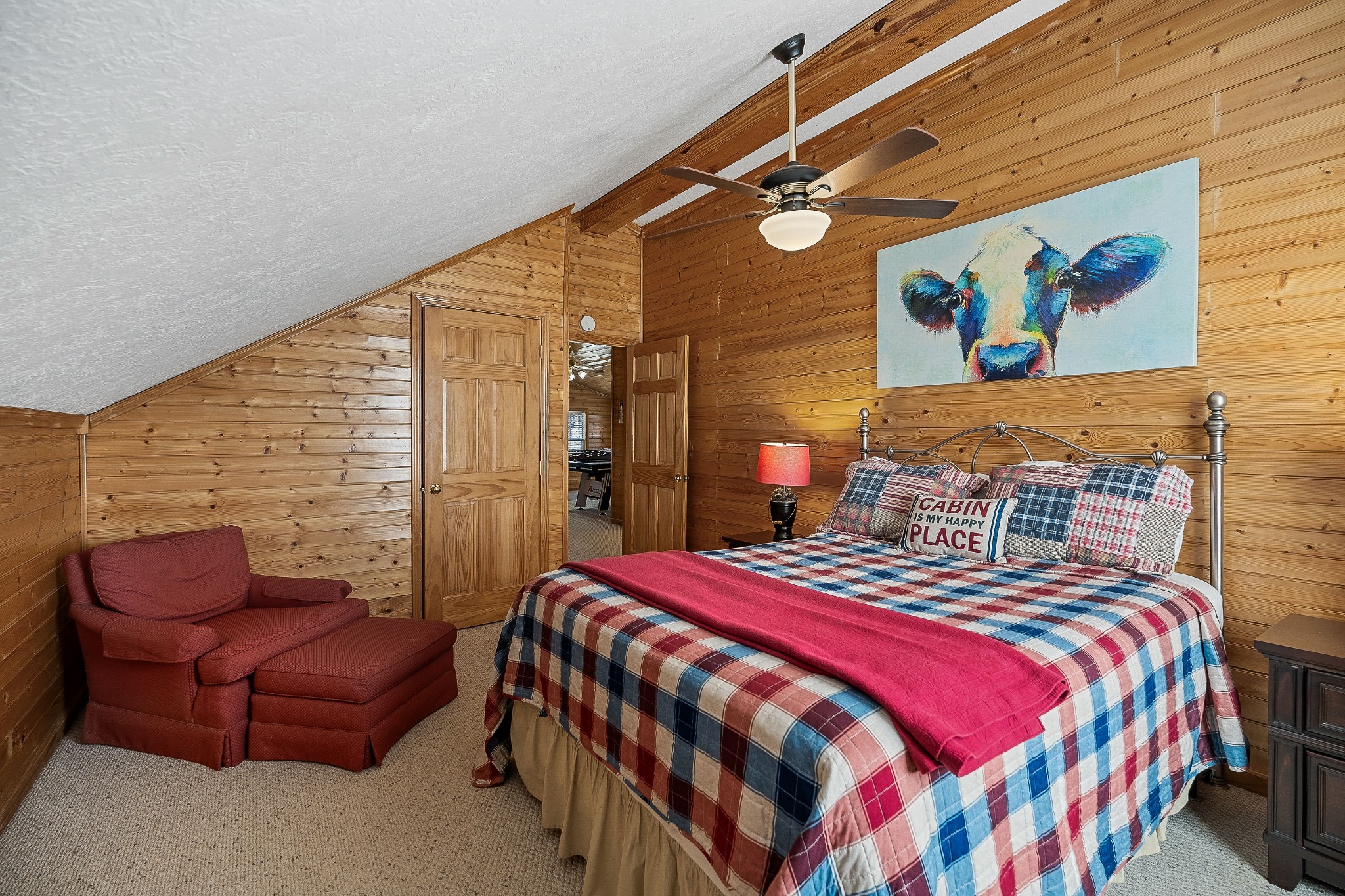 5606 Eastport Road Alpine, TN 38543 - Photo 43 of 44 a bedroom with a bed a couch and painting on the wall