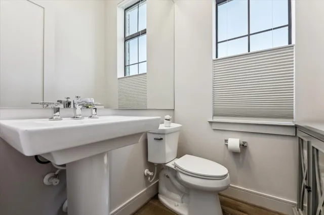 a spacious bedroom with a bed and a flat screen tv