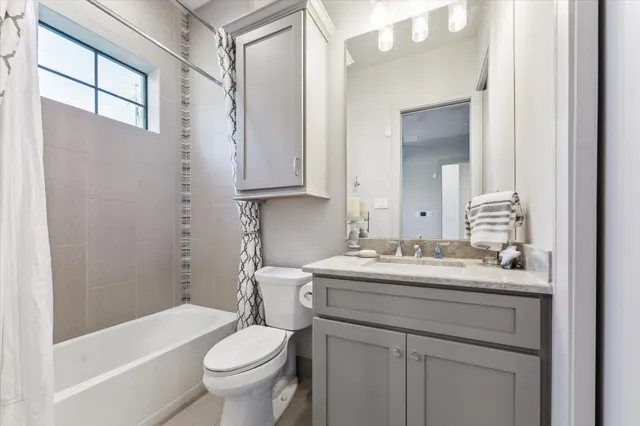 a living room with furniture window and wooden floor