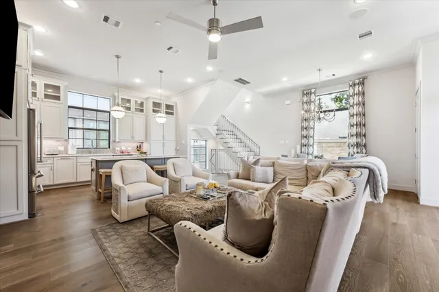 a kitchen with a table chairs refrigerator and cabinets