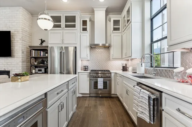 a living room with fireplace furniture and a flat screen tv