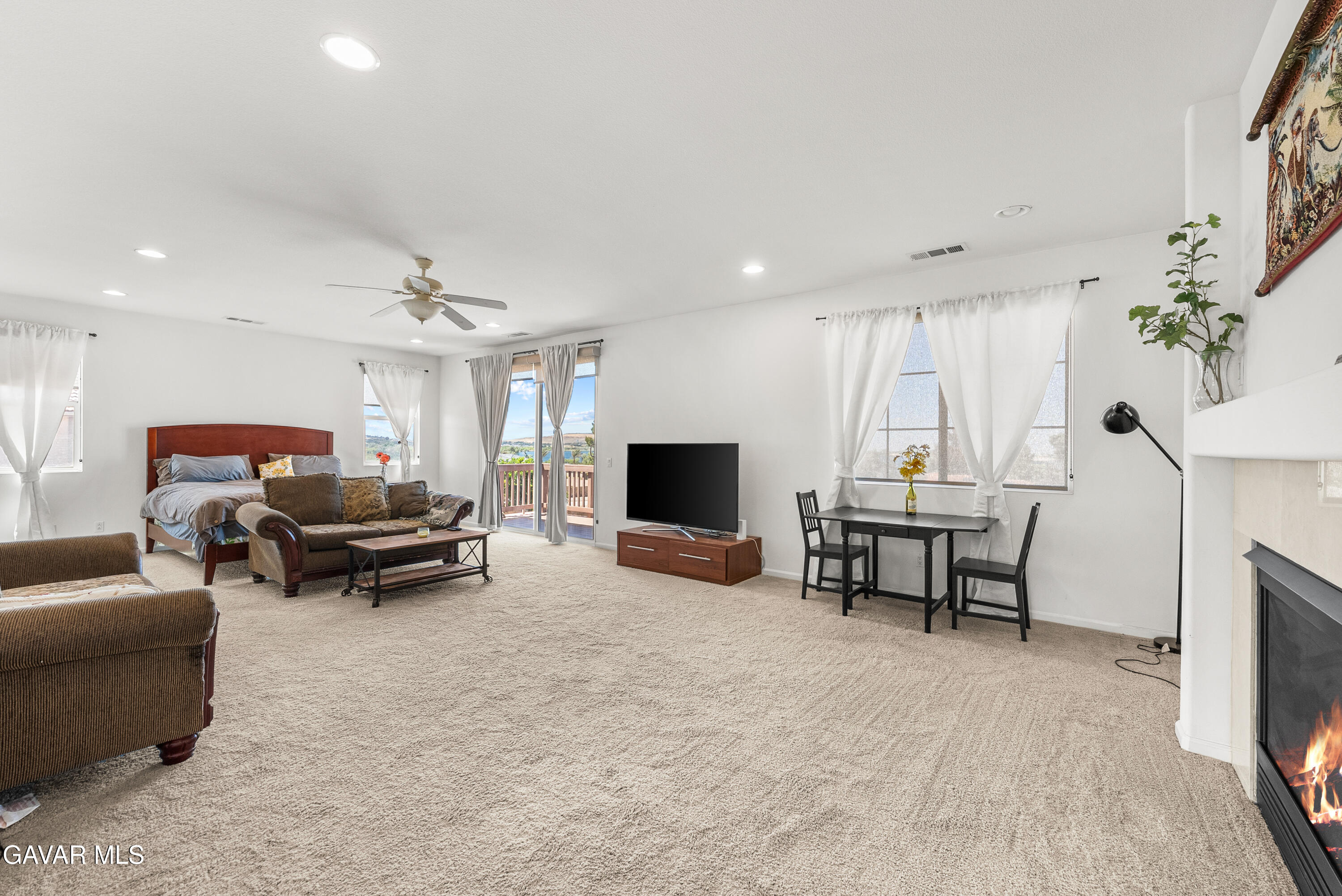 658 Lago Lindo Road Palmdale, CA 93550 - Photo 48 of 91 a living room with furniture and a flat screen tv