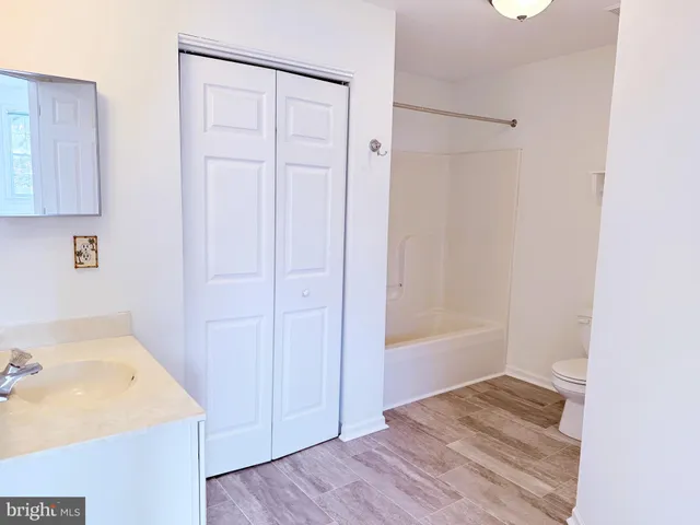 a bathroom with a sink and a shower