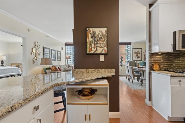 a kitchen with stainless steel appliances granite countertop a stove and a sink