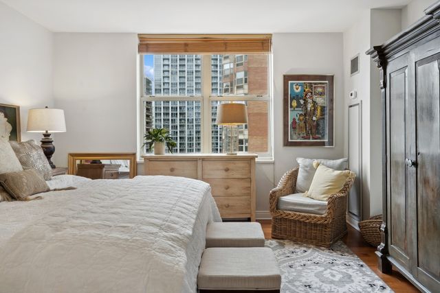 a bedroom with a bed furniture and a window