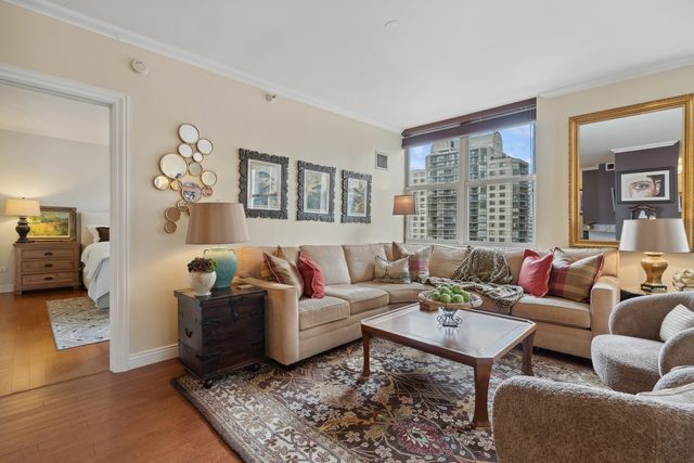 a living room with fireplace furniture and a table