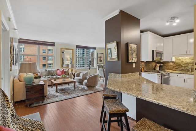 a large kitchen with granite countertop lots of counter top space
