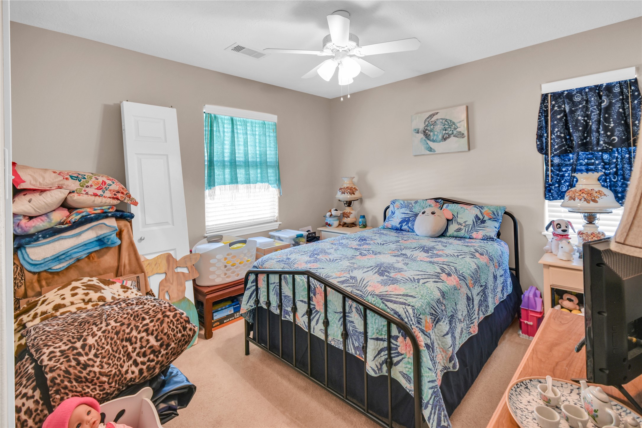115 Driftwood Road Freeport, TX 77541 - Photo 14 of 21 a bedroom with a bed and a window