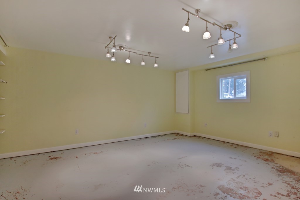 713 Southwest Langston Road Renton, WA 98057 - Photo 22 of 31 a view of an empty room with a window