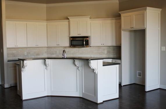 10306 Iola Lubbock, TX 79424 - Photo 6 of 10 a kitchen with granite countertop white cabinets and a sink
