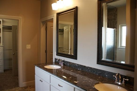 10306 Iola Lubbock, TX 79424 - Photo 10 of 10 a bathroom with a granite countertop sink and a mirror