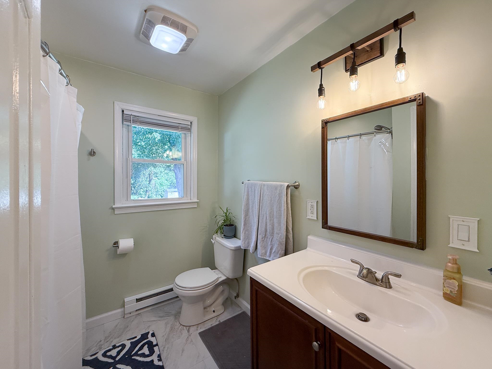 39 View Drive Stuarts Draft, VA 24477 - Photo 20 of 25 a bathroom with a toilet sink and mirror