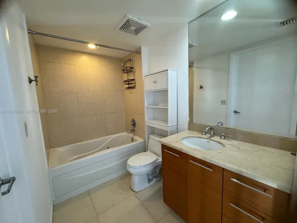 a bathroom with a toilet and a sink