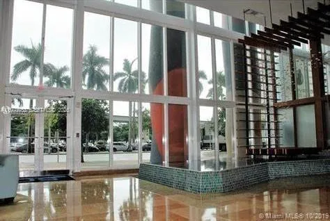 a view of a swimming pool with a lawn chairs