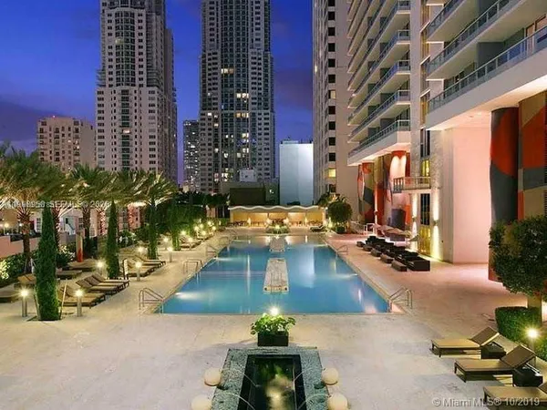 a view of swimming pool with outdoor seating