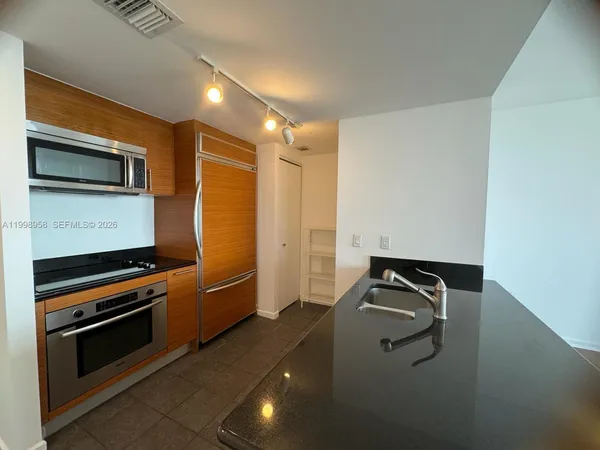 a kitchen with a stove and a microwave