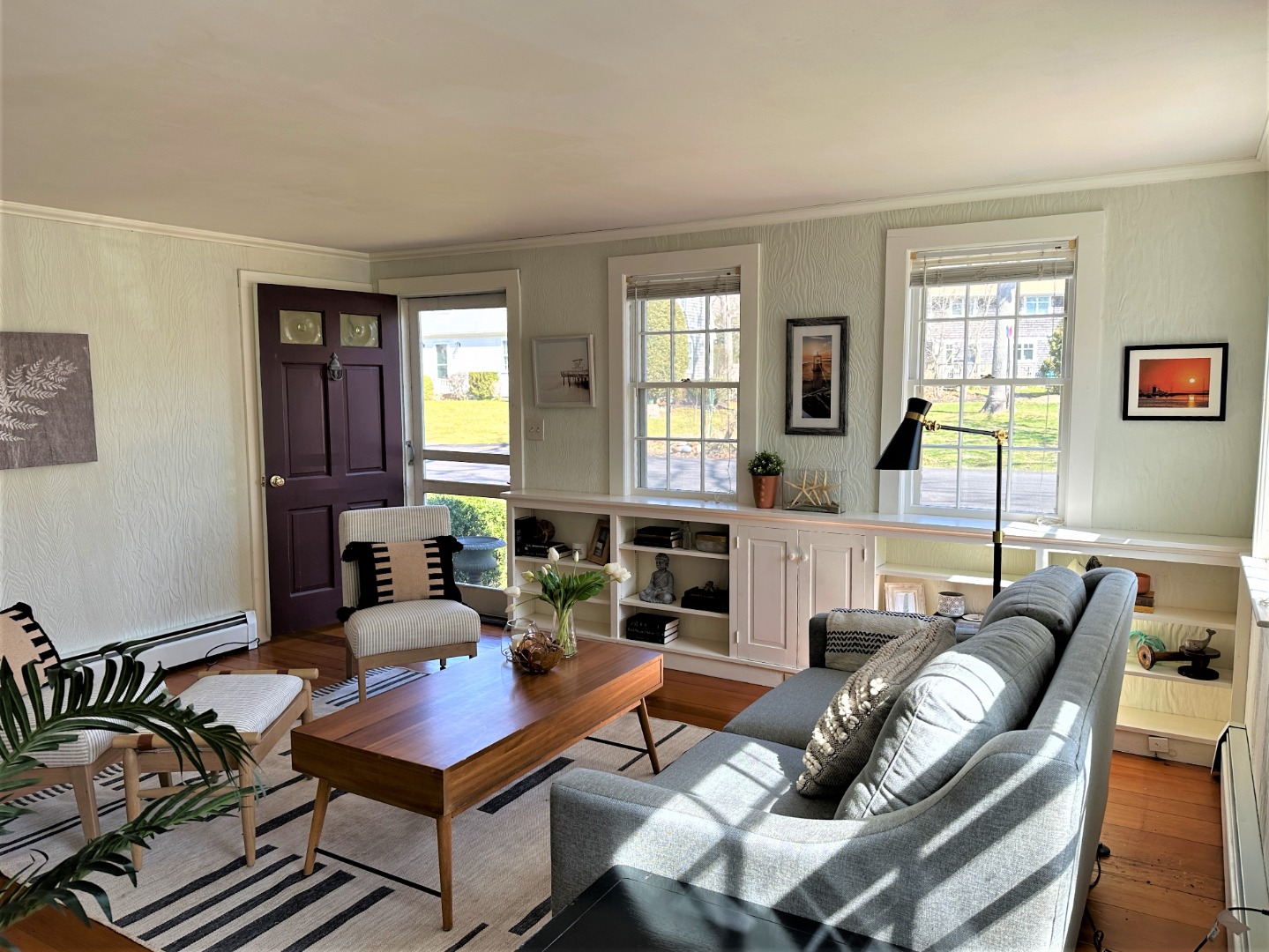 45 Pine Tree Lane Vineyard Haven, MA 02568 - Photo 11 of 25 a living room with furniture a fireplace and a table