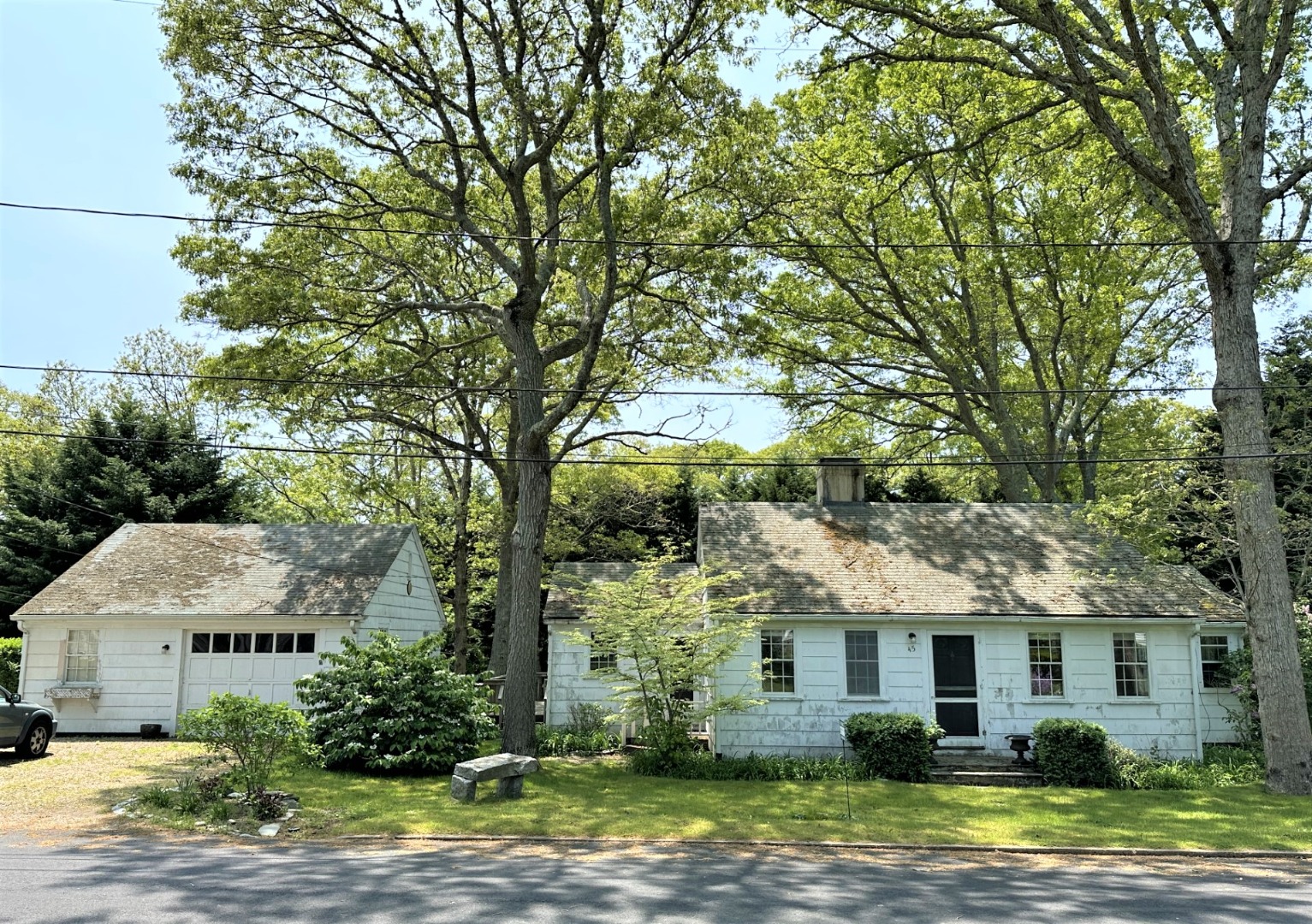 45 Pine Tree Lane Vineyard Haven, MA 02568 - Photo 24 of 25 a view of a white house with a large windows and large tree