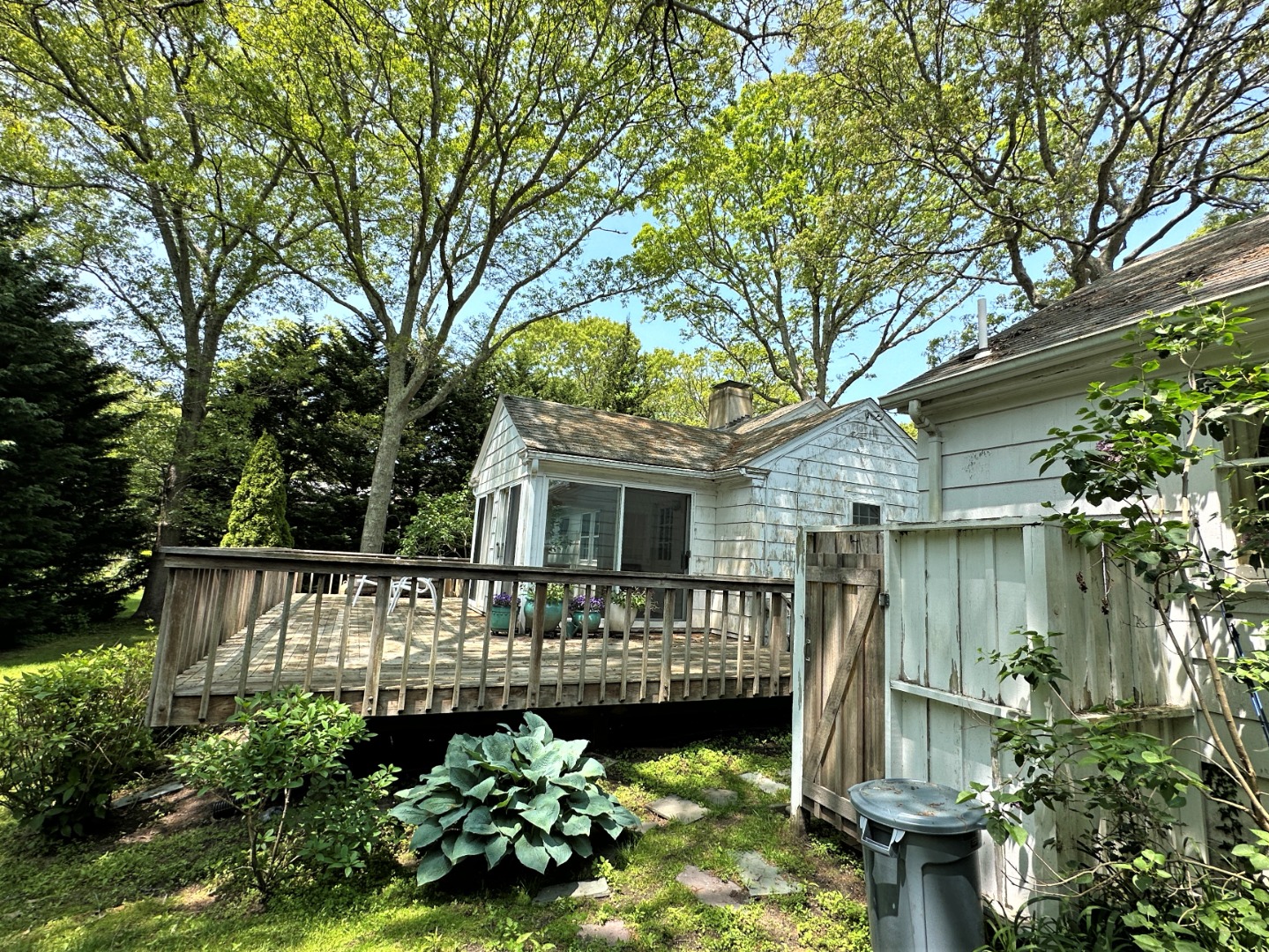 45 Pine Tree Lane Vineyard Haven, MA 02568 - Photo 3 of 25 a front view of a house with a garden