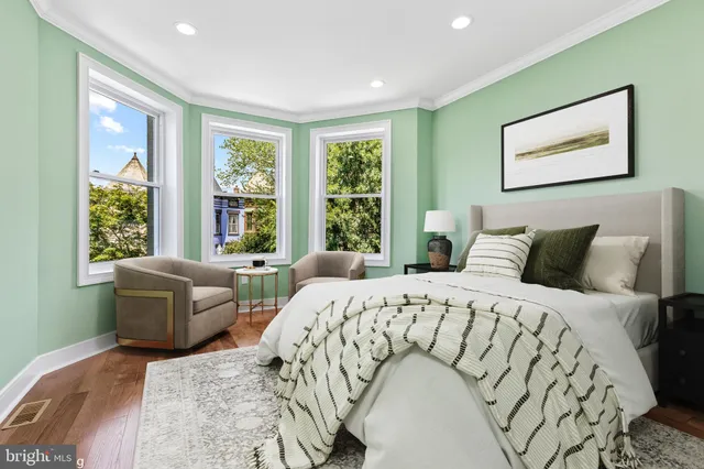 a bedroom with a bed and a couch