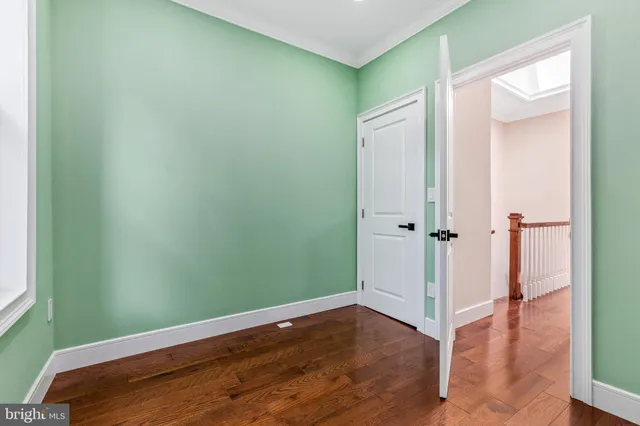 an empty room with wooden floor