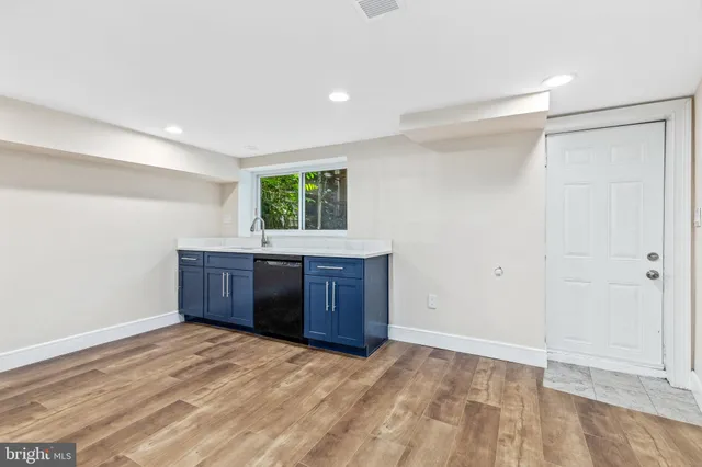 a room with a cabinet and a window