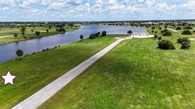 a view of a lake with a building in the background