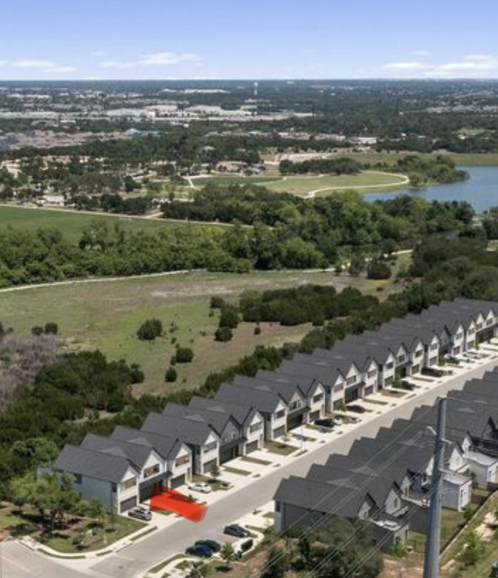 590 Old Mill Road, Unit 153 Cedar Park, TX 78613 - Photo 2 of 40 an aerial view of a city with lots of residential buildings