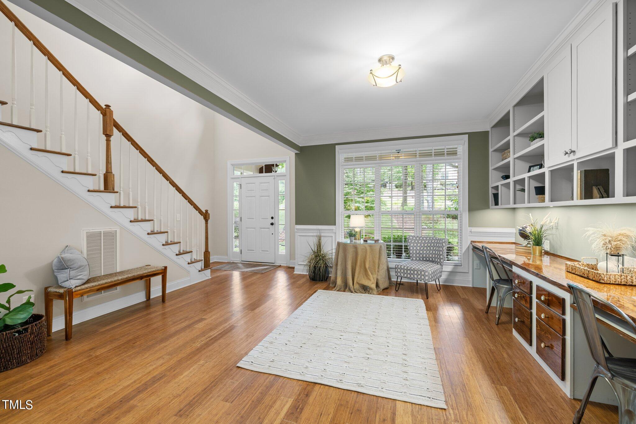 152 Roads End Pittsboro, NC 27312 - Photo 11 of 58 a living room with furniture and a wooden floor