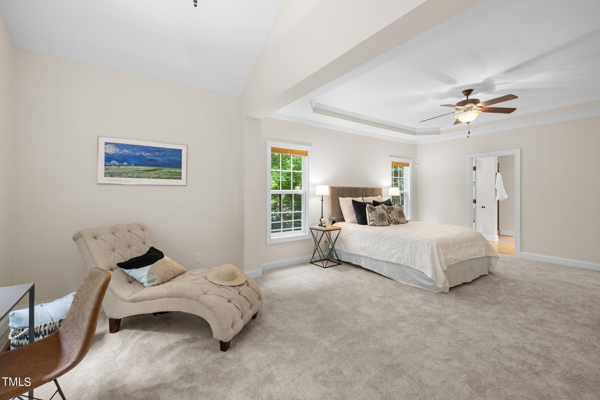 152 Roads End Pittsboro, NC 27312 - Photo 19 of 58 a bedroom with a bed and a chandelier