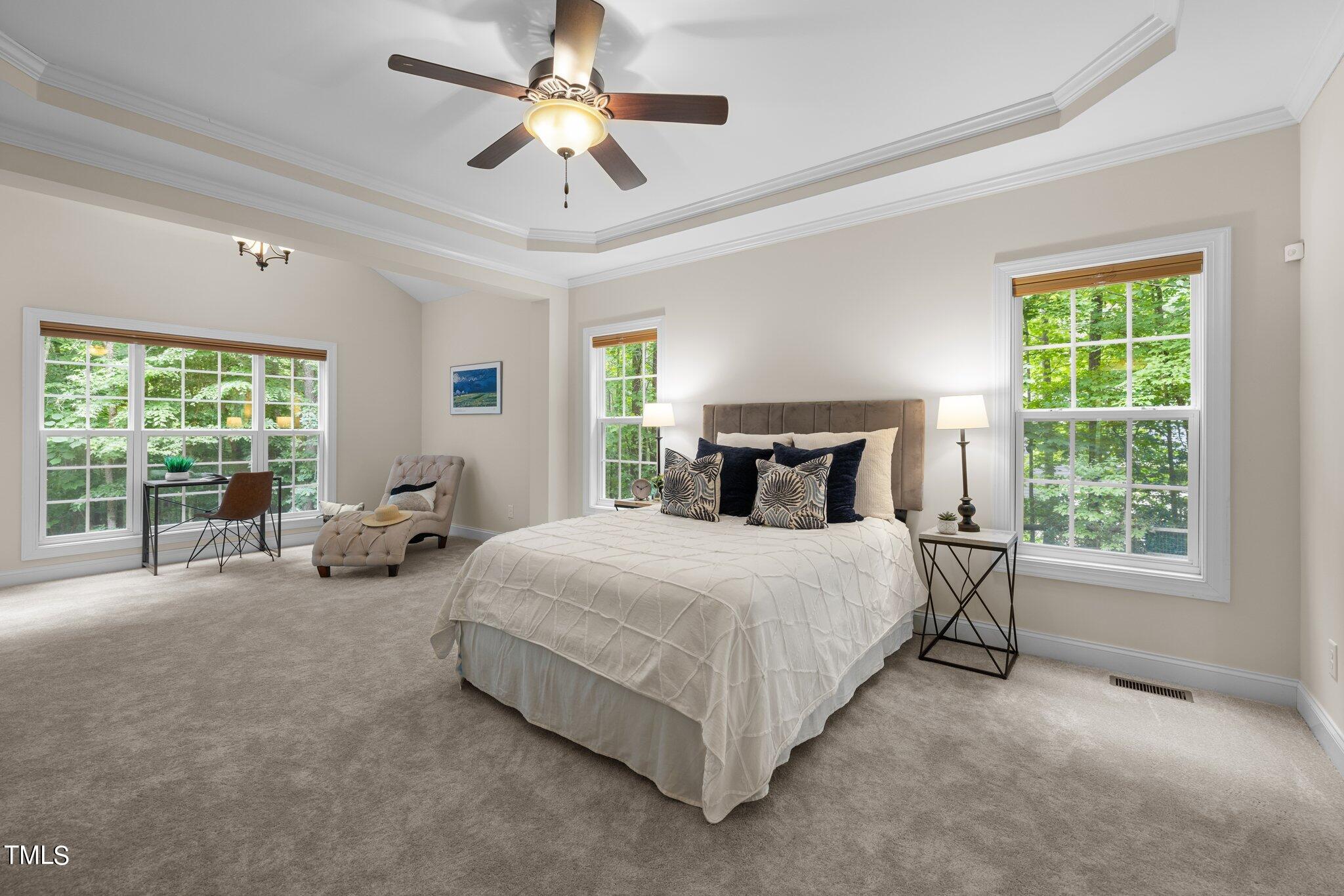 152 Roads End Pittsboro, NC 27312 - Photo 20 of 58 a spacious bedroom with a bed and a large window