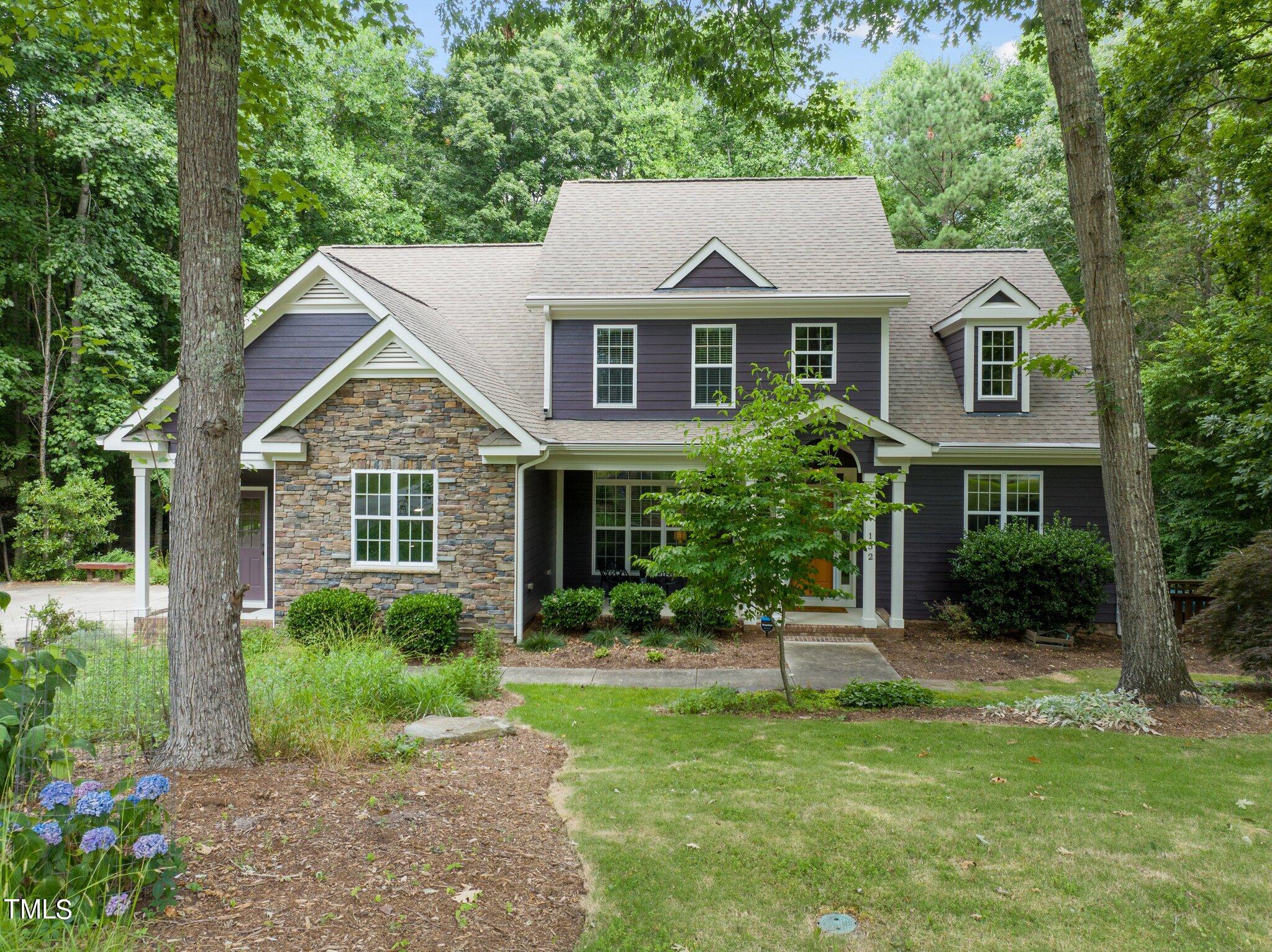 152 Roads End Pittsboro, NC 27312 - Photo 2 of 58 a front view of a house with a yard
