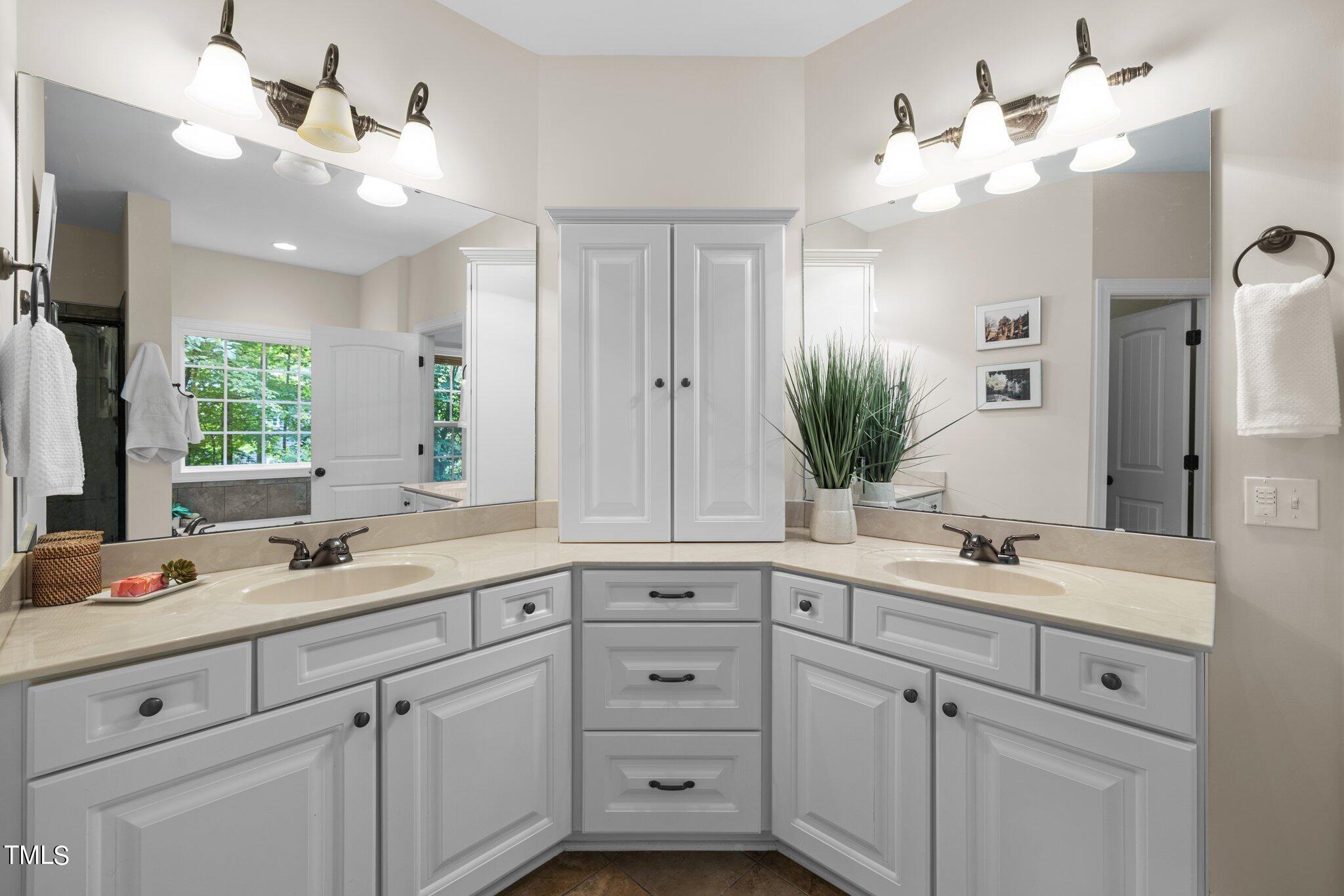 152 Roads End Pittsboro, NC 27312 - Photo 23 of 58 a bathroom with white cabinets and a sink