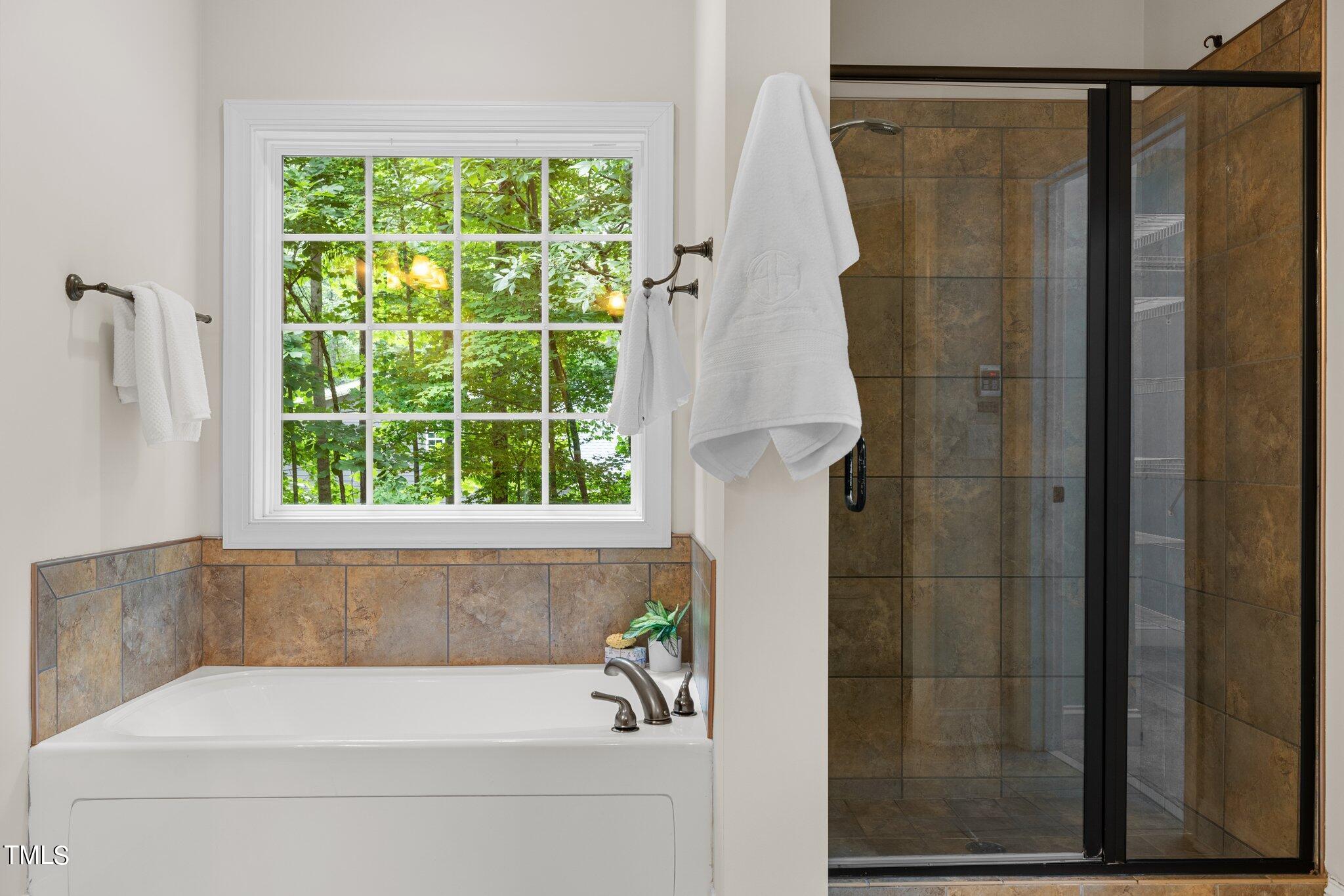 152 Roads End Pittsboro, NC 27312 - Photo 26 of 58 a bathroom with a shower and a bathtub