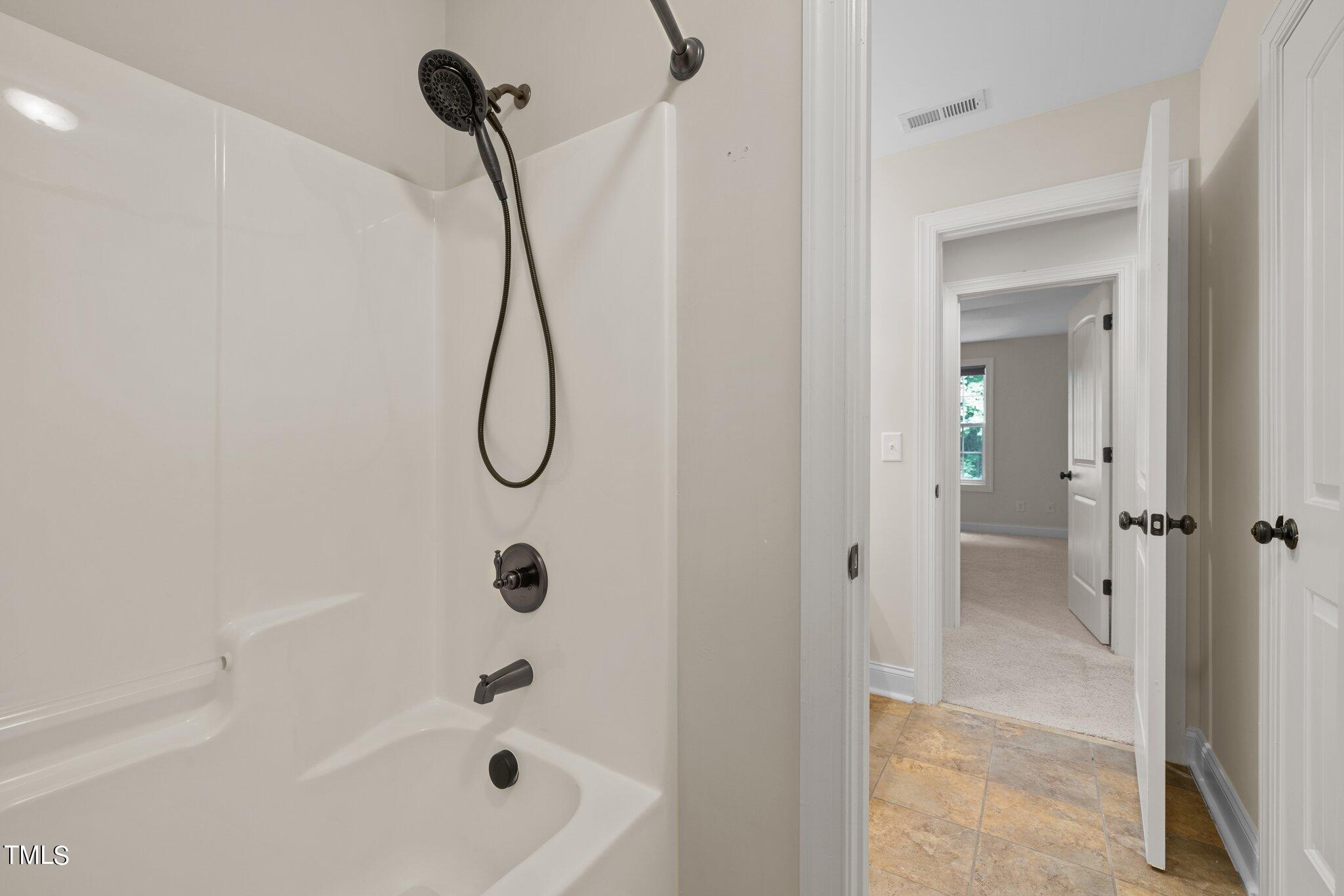 152 Roads End Pittsboro, NC 27312 - Photo 28 of 58 a bathroom with a bath tub with shower