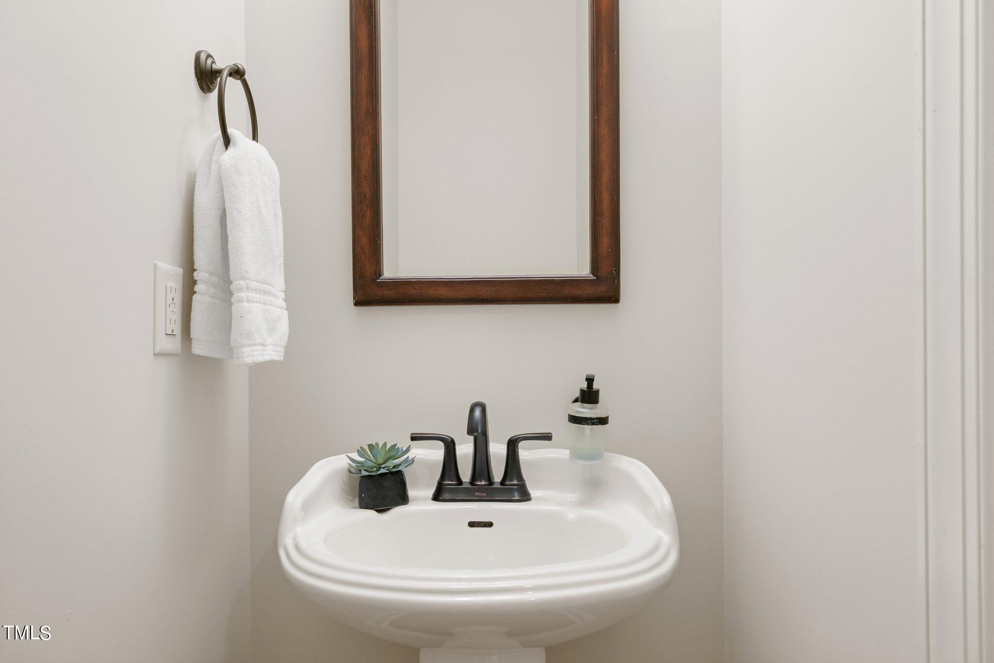 152 Roads End Pittsboro, NC 27312 - Photo 35 of 58 a bathroom with a sink and a mirror