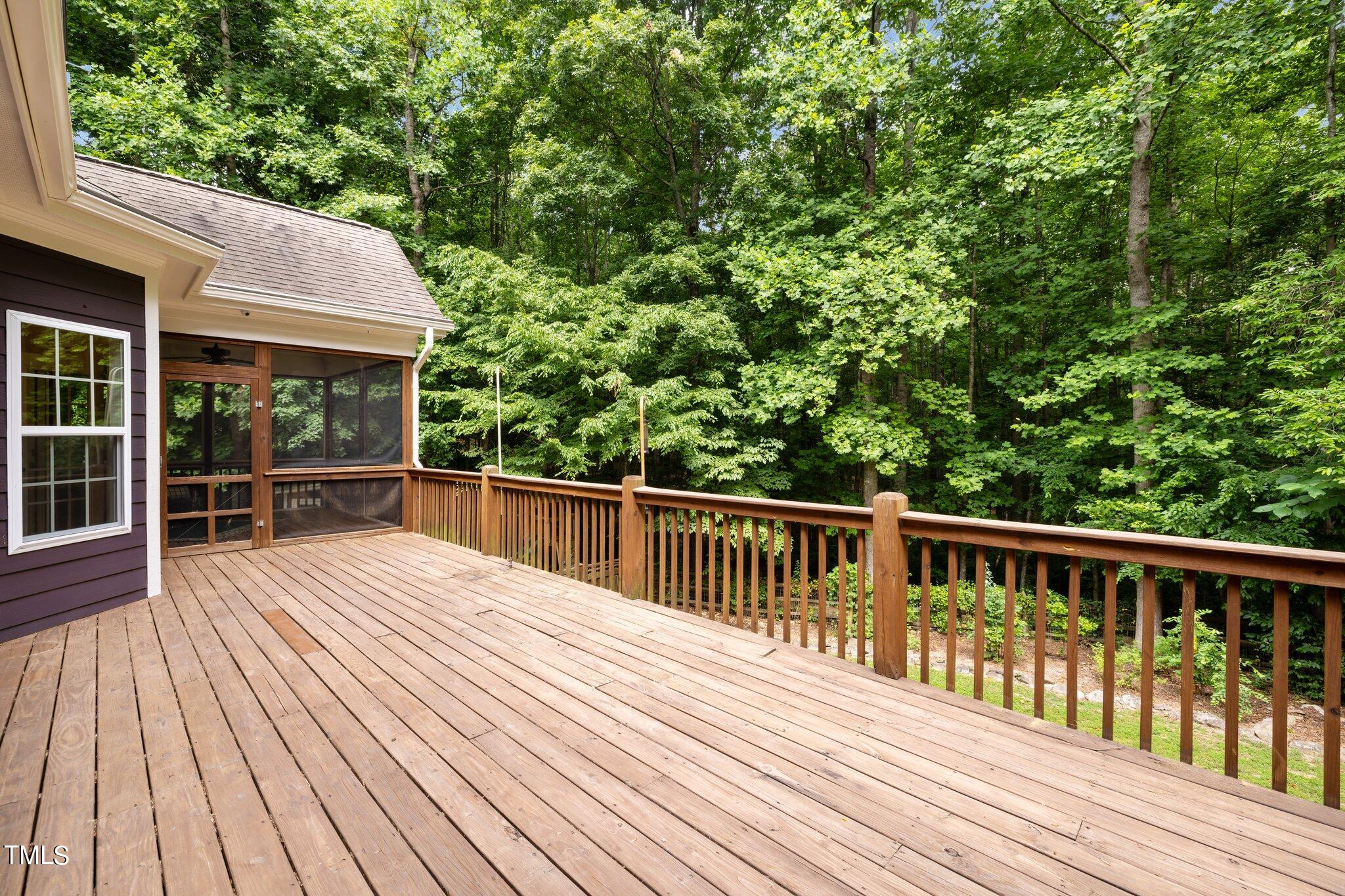 152 Roads End Pittsboro, NC 27312 - Photo 44 of 58 a view of backyard with small deck and wooden floor