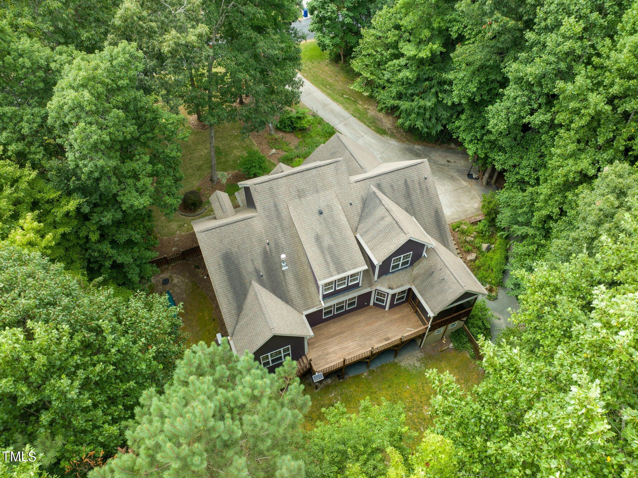 152 Roads End Pittsboro, NC 27312 - Photo 50 of 58 an aerial view of a house with backyard space and garden