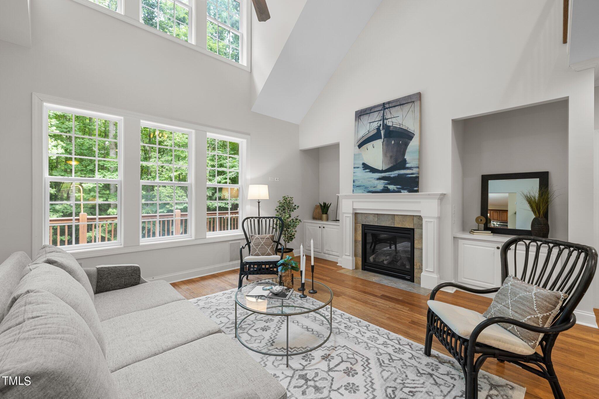 152 Roads End Pittsboro, NC 27312 - Photo 5 of 58 a living room with furniture a fireplace and a large window