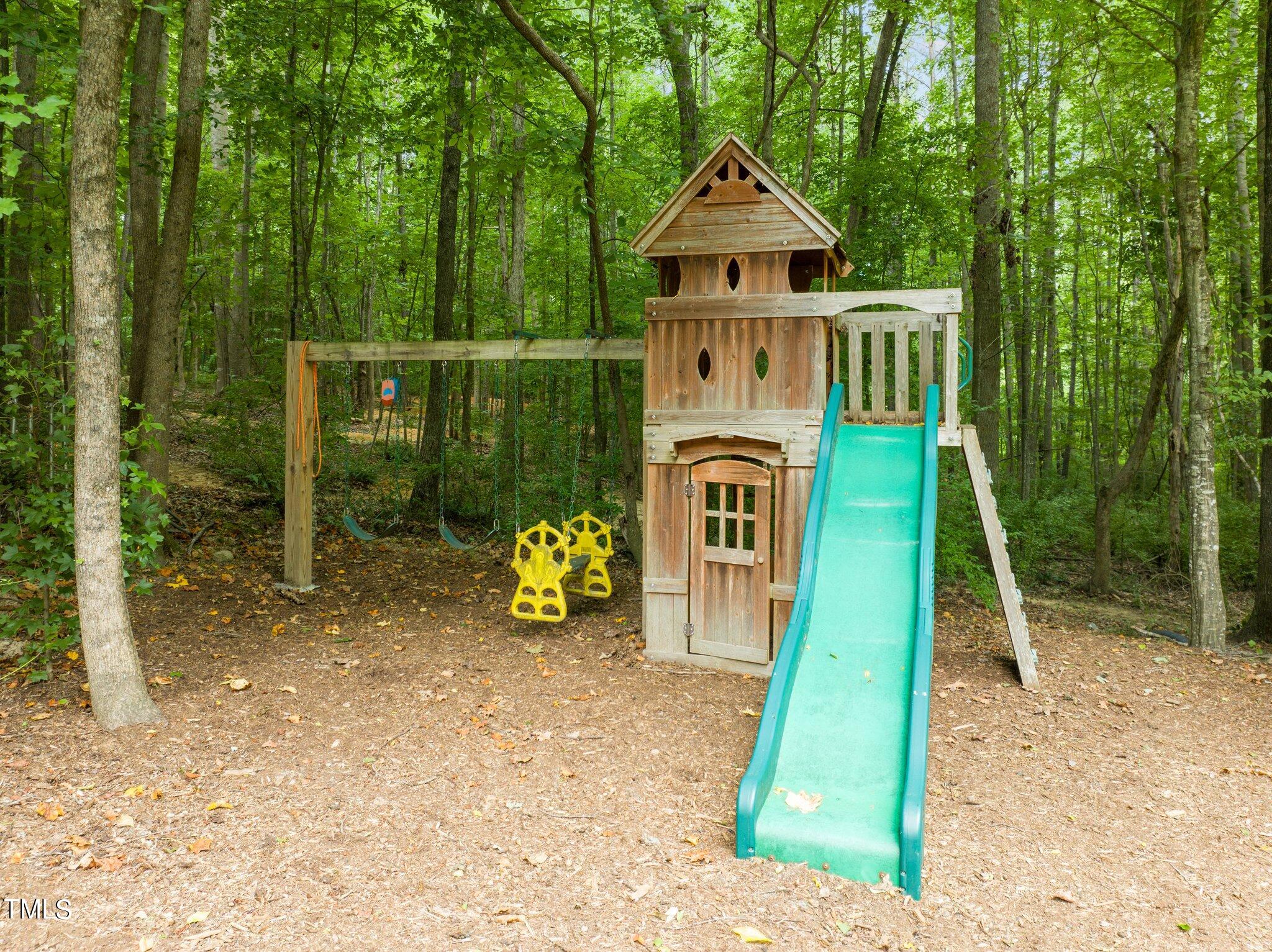 152 Roads End Pittsboro, NC 27312 - Photo 51 of 58 a front view of a house with garden