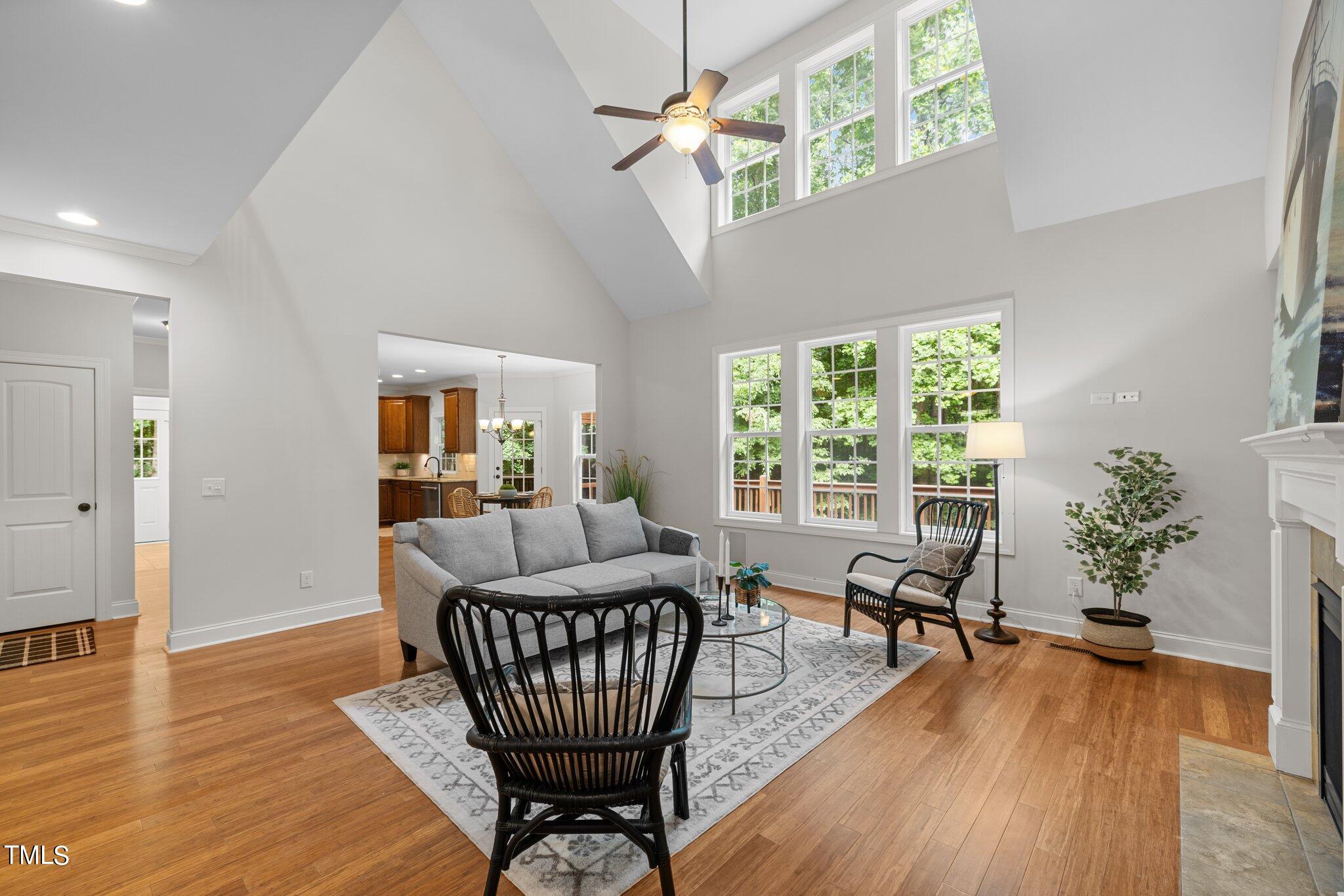 152 Roads End Pittsboro, NC 27312 - Photo 8 of 58 a living room with furniture a potted plant and a large window